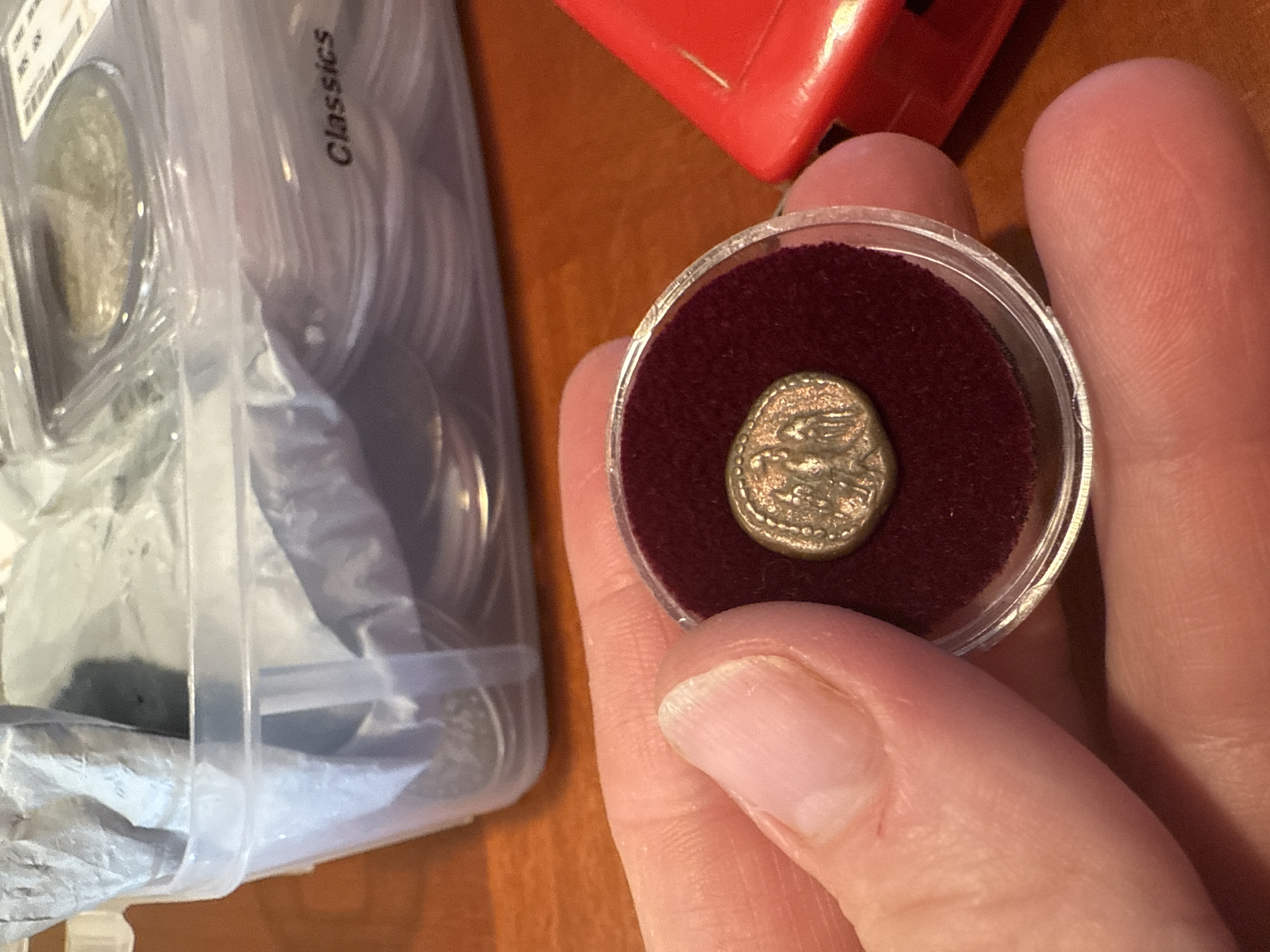 Coin with eagle and beading on one side
