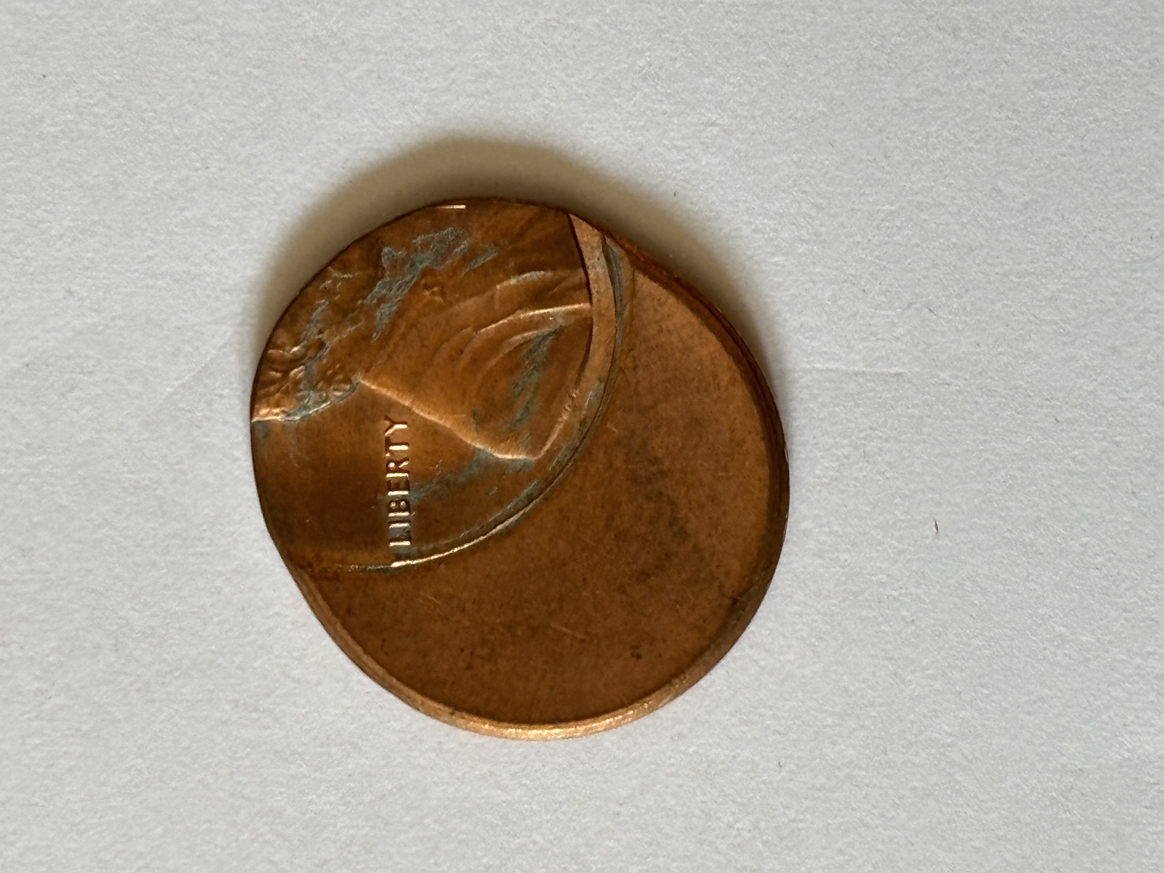 Off center stamped penny