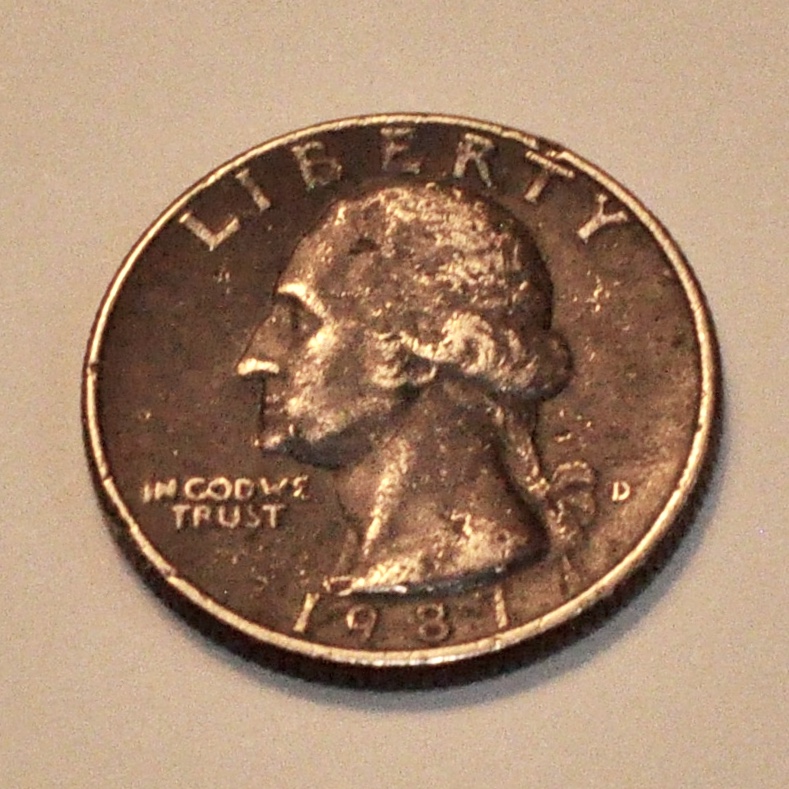 Black 1987 quarter with a backward 3 where…