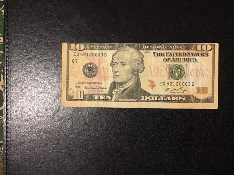 10 dollar bill front top cut off back…