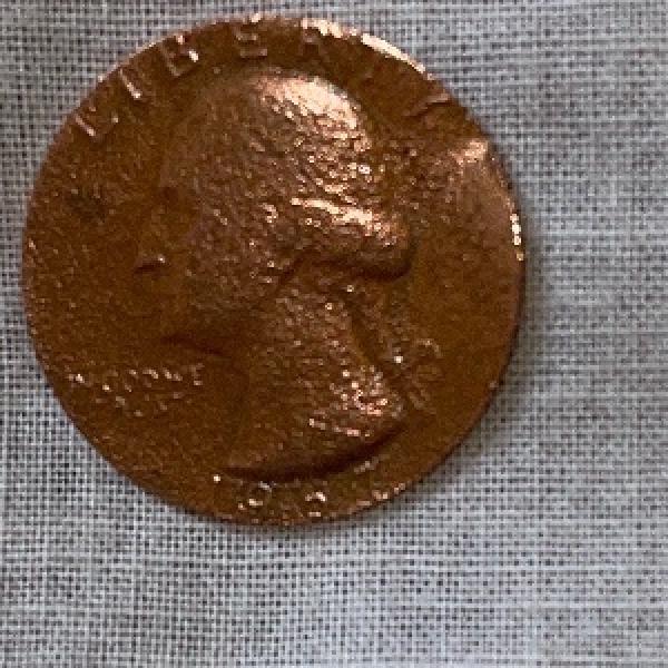 Is this an error quarter coin? It’s copper…