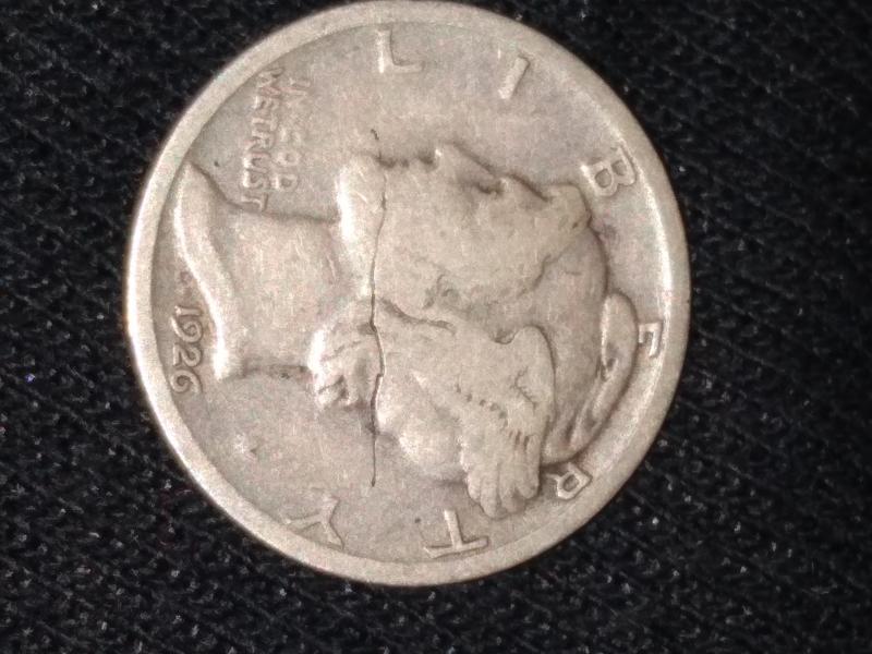 Error coin cracked through whole dime