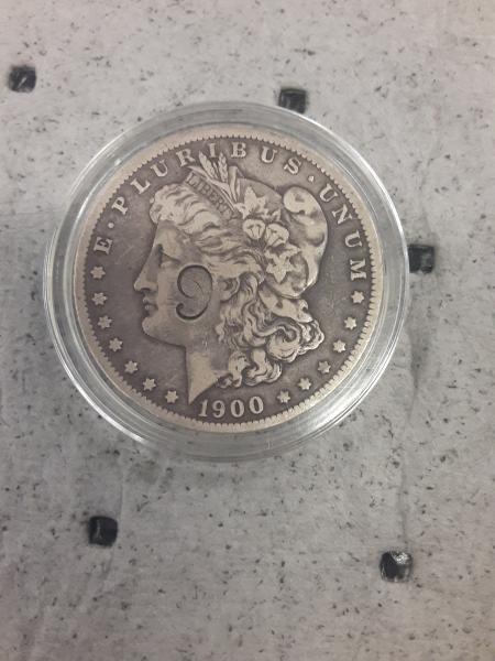 1900 Morgan silver dollar miss struck