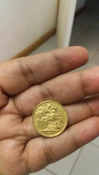 Round gold coin. Foreign to me. Seems like&hellip;
