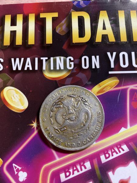 It’s a Chinese coin that saids 7 mace&hellip;