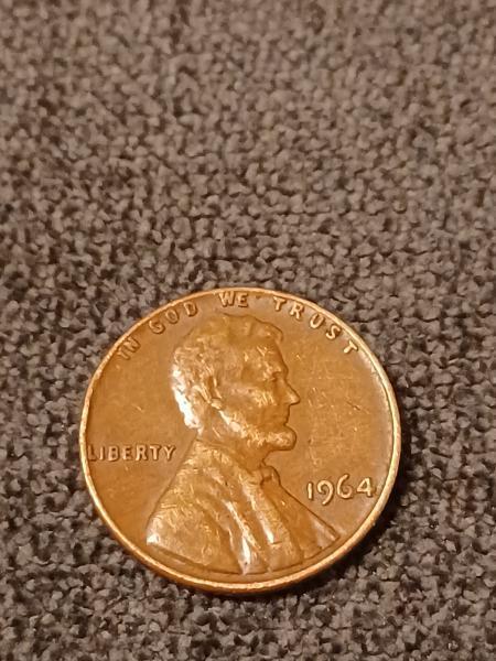 1964 penny. No mint mark. Smooth texture, almost&hellip;