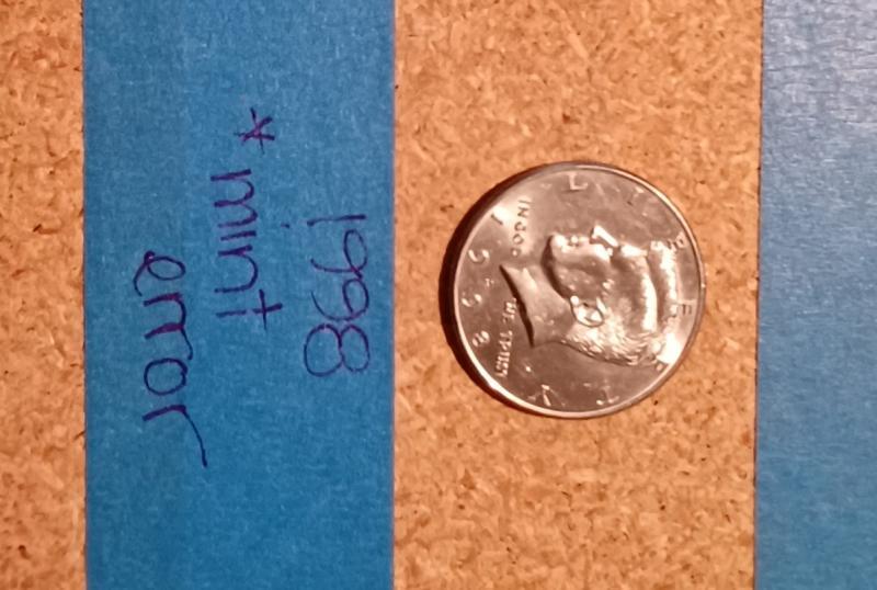 Rim and letters intact. 1998 half dollar.