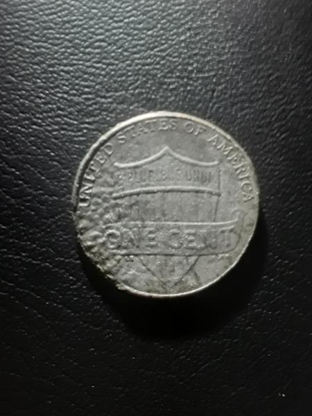 2021-D penny larger then a regular penny and…