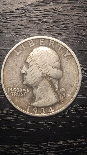 Pure silver 1934 quarter with what i believe…