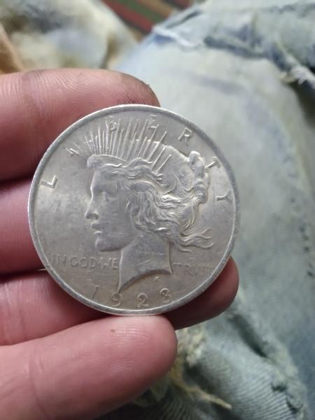 1923 silver peace dollar with errors on rim…