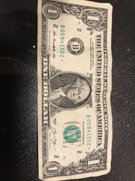 US $ 1 note with serial number B05841502*