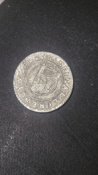Coin says Continental Curency 1776 abd FUGIO on&hellip;