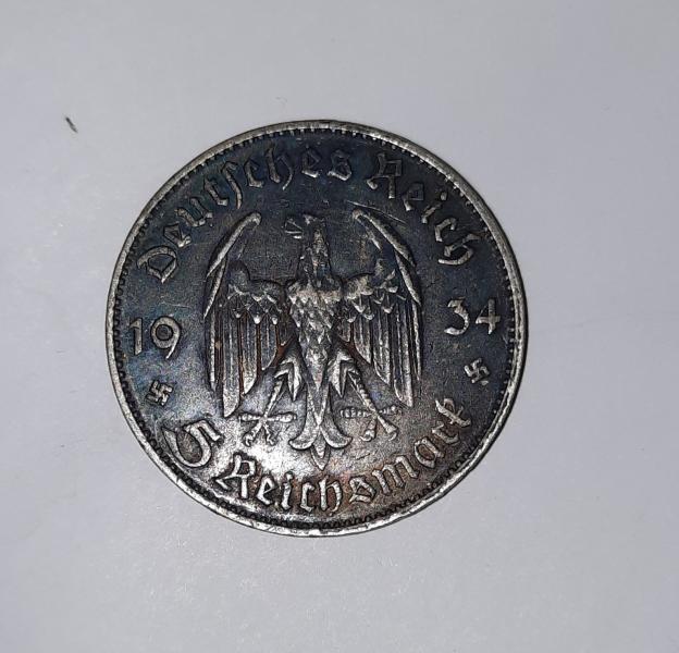Pictures are of two coins front and back&hellip;