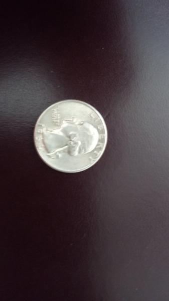 1964 quarter appears to be in excellent condition.