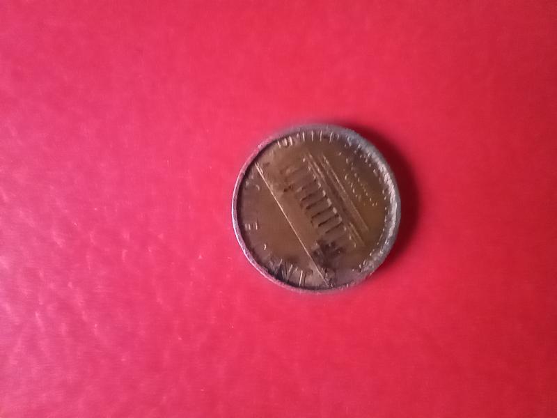 1995 penny stamped on a dime