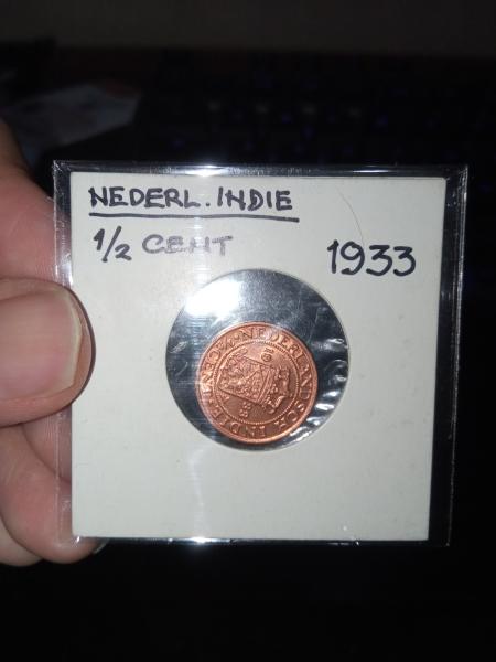 a 1/2 cent coin from 1933. The coin…