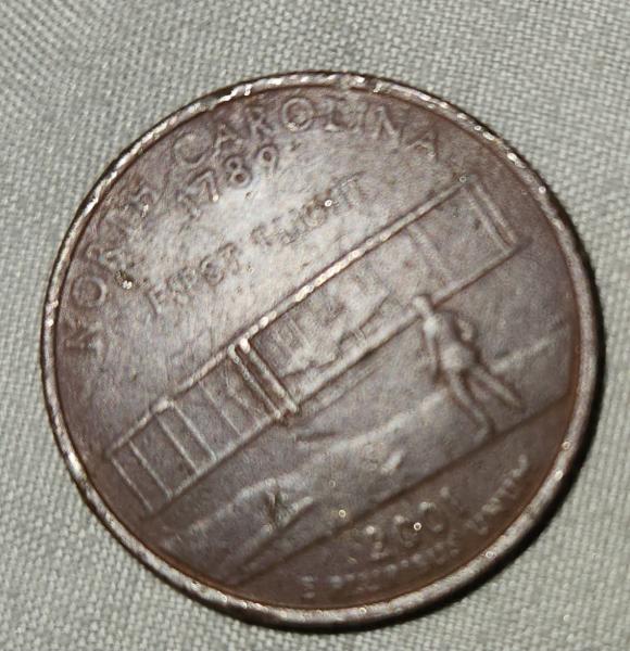 A North Carolina state quarter that appears to…