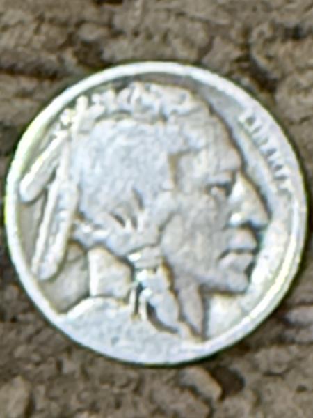 Buffalo Nickel with a significant cross above the…