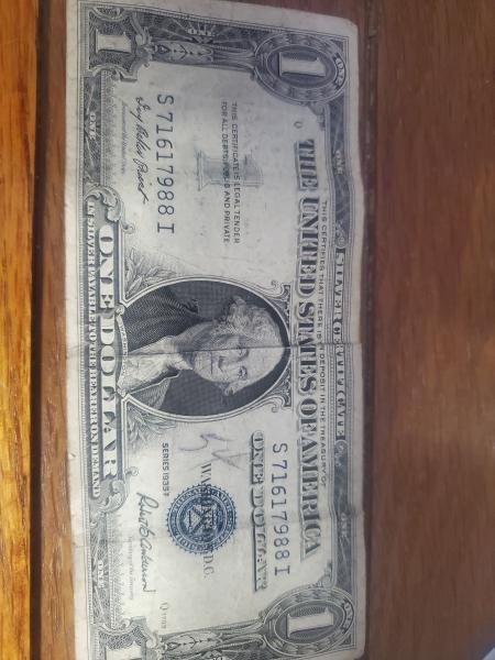 One dollar silver certificate with blue stamp from…
