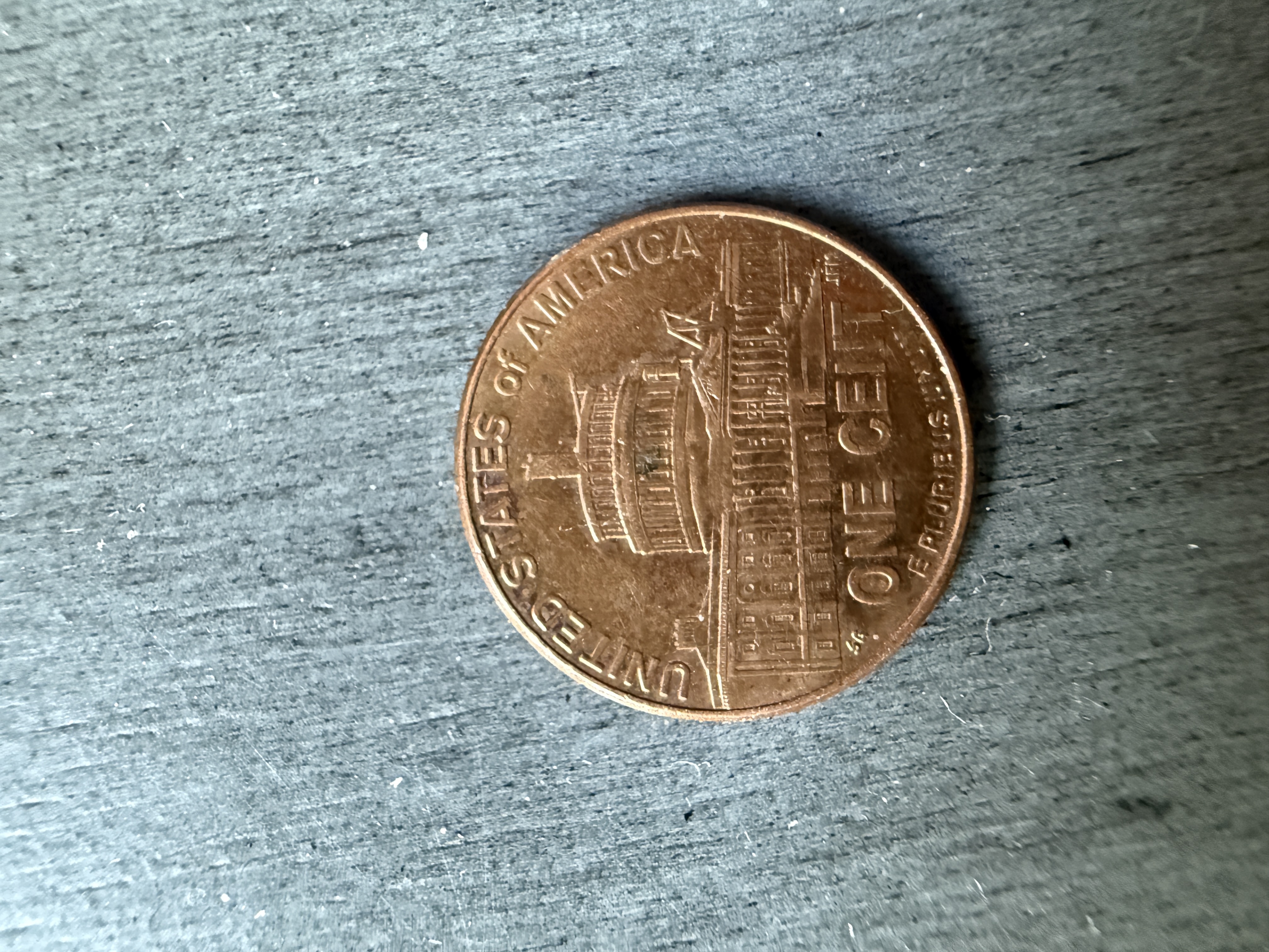 This penny has a black mark ( like…