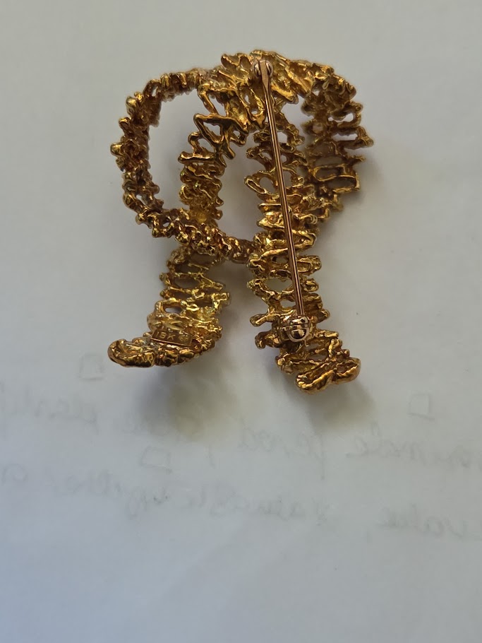 Textured gold brooch with pin mechanism- has markings&hellip;